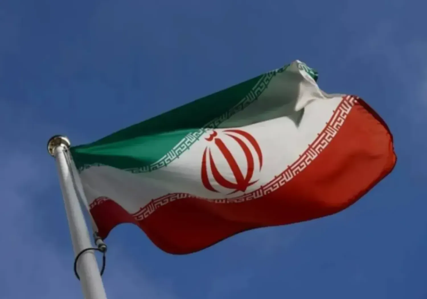 The Iranian flag waves in front of the International Atomic Energy Agency (IAEA) headquarters, before the beginning of a board of governors meeting, amid the coronavirus disease (COVID-19) outbreak in Vienna, Austria, March 1, 2021. (Reuters)
