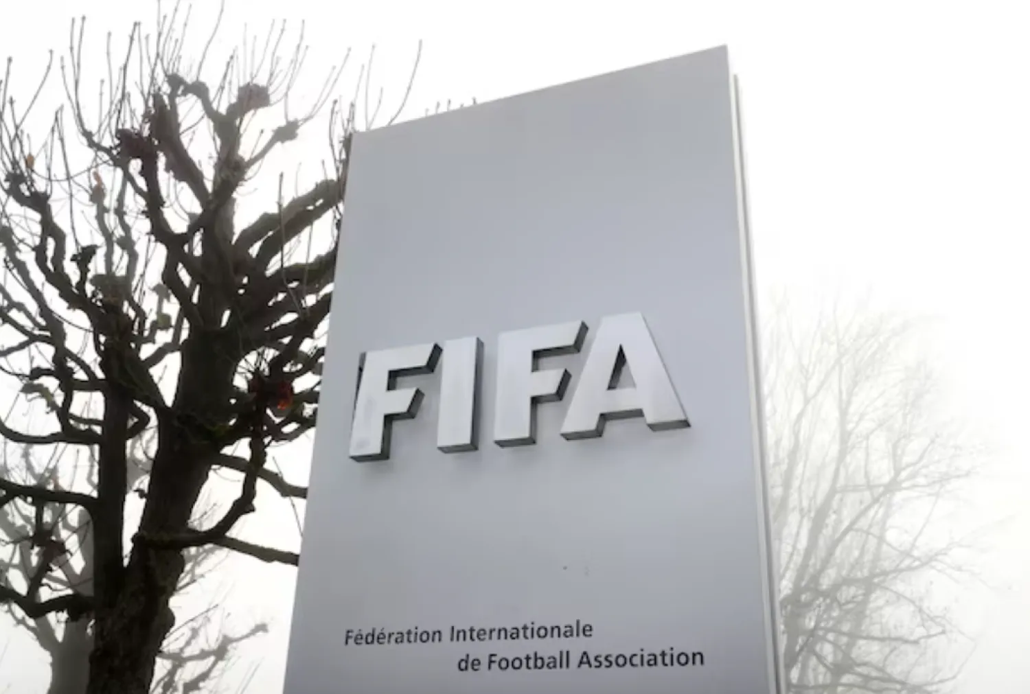 FIFA's logo is seen in front of its headquarters during a foggy autumn day in Zurich, Switzerland November 18, 2020. REUTERS/Arnd Wiegmann 