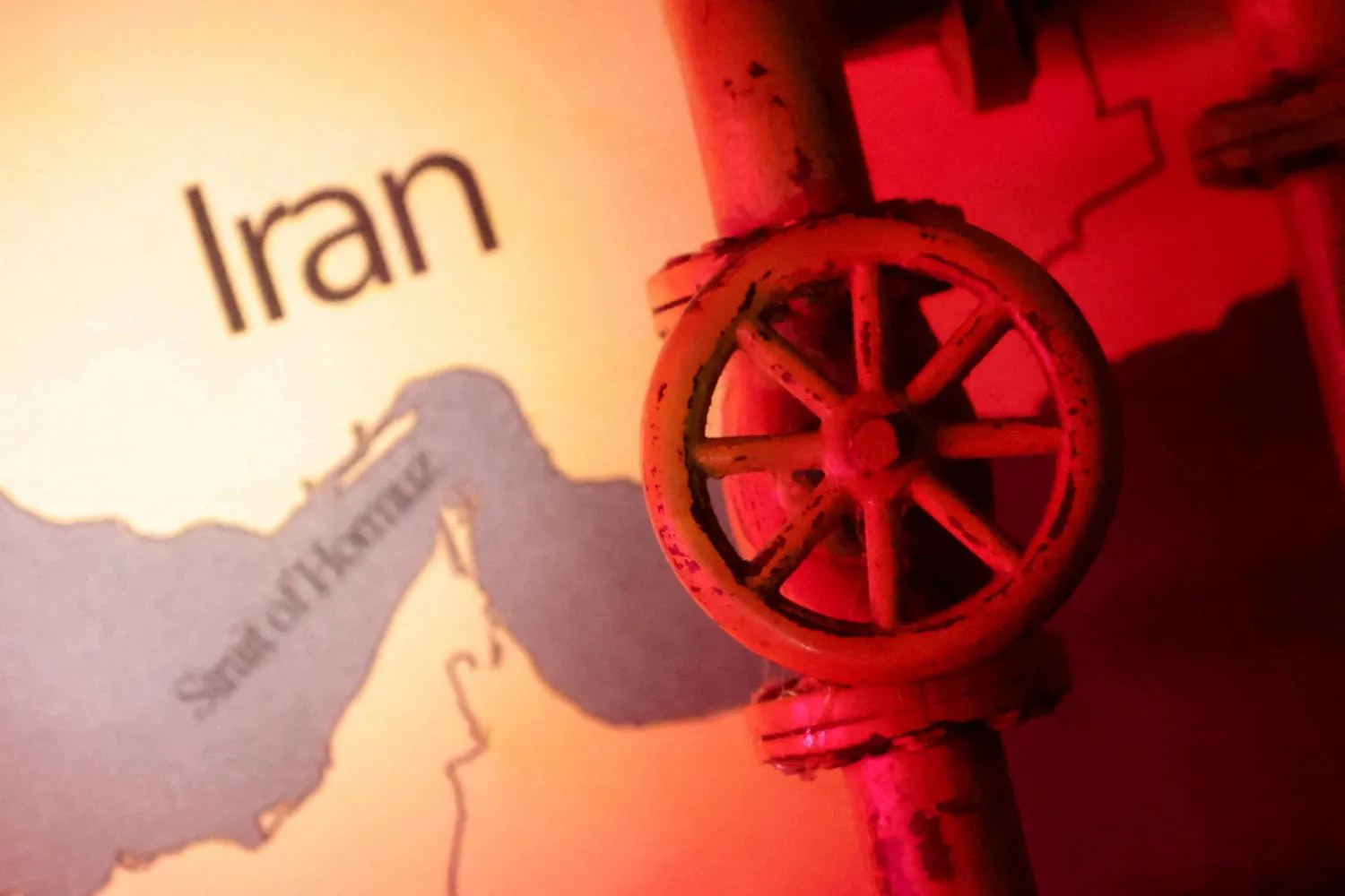 FILE PHOTO: A map showing the Strait of Hormuz and Iran is seen behind a 3D printed oil pipeline in this illustration taken June 22, 2025. REUTERS/Dado Ruvic/Illustration/File Photo