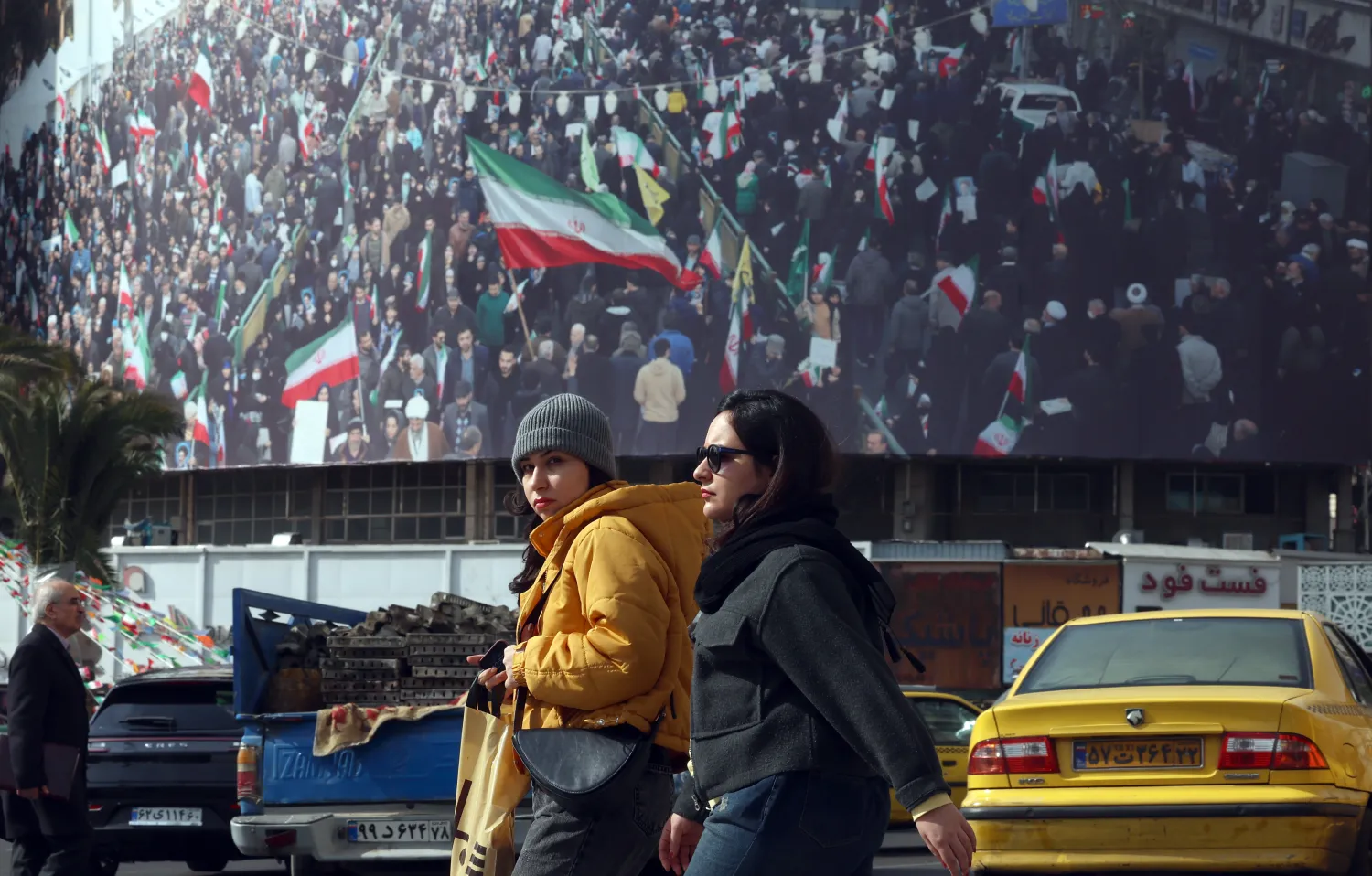 Iranians walk in a street in Tehran, Iran, 02 February 2026. (EPA)