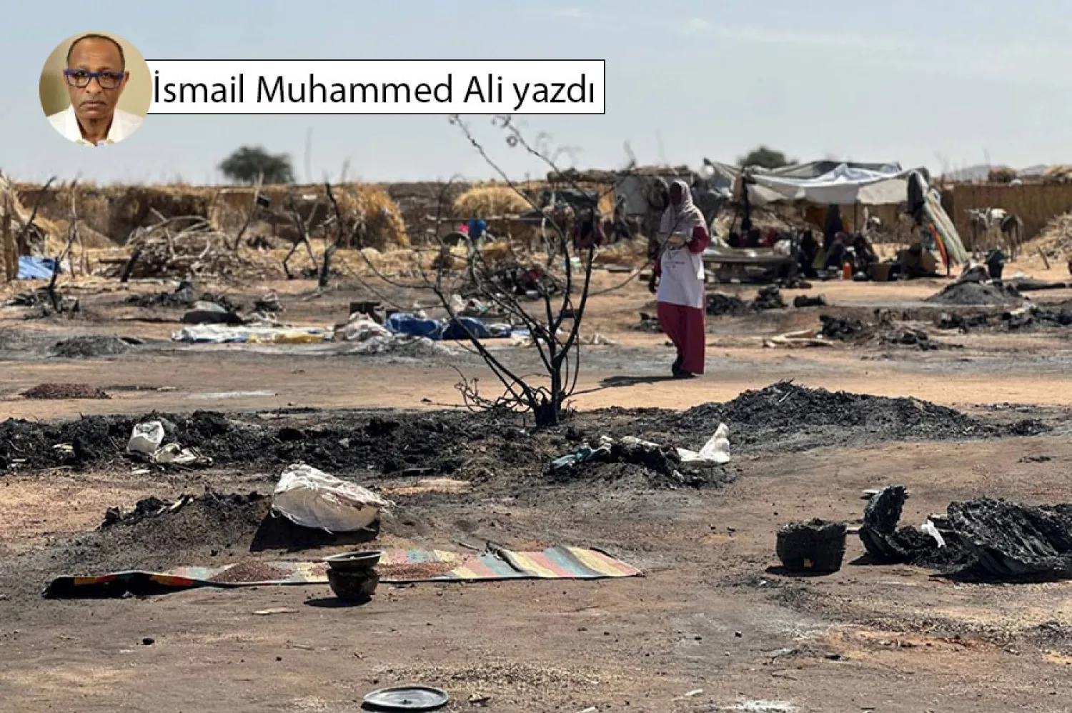 Tavile'deki bir mülteci kampında çıkan yangının ardından El Faşir'den ayrılan yerinden edilmiş bir Sudanlı kadın, 11 Şubat 2026 (AFP)