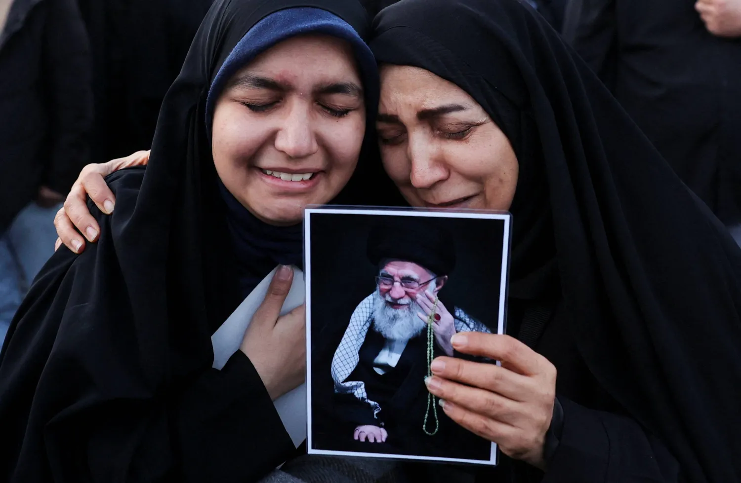 People react as they gather at the Enghelab Square, after Iran's Supreme Leader Ali Khamenei was killed in Israeli and US strikes on Saturday, in Tehran, Iran, March 1, 2026. Majid Asgaripour/WANA (West Asia News Agency) via REUTERS  