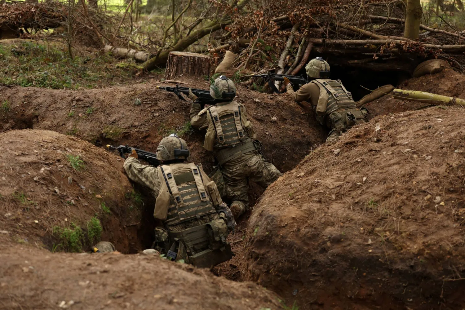 Ukrainian soldiers take part in a final tactical exercise on the fourth anniversary of Russia's full-scale invasion of Ukraine, held at a British Army training camp in East Anglia, Britain, February 24, 2026. REUTERS/Chris Radburn