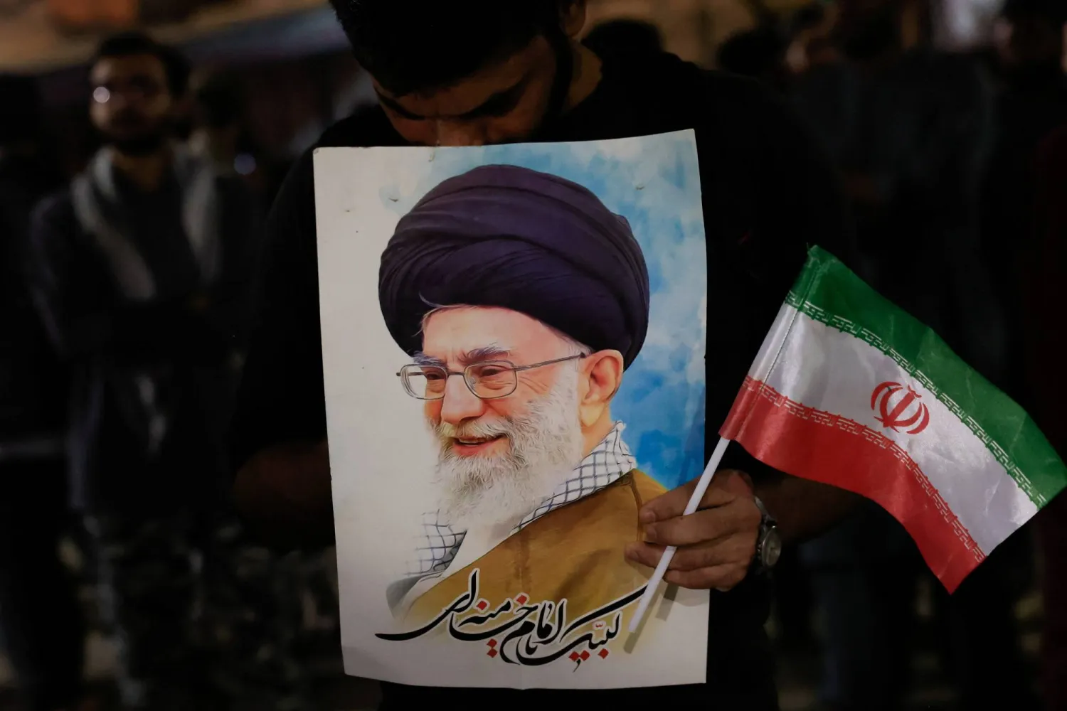  A Shiite supporter of the Imamia Student Organization (ISO) holds a portrait of Iran's Supreme Leader Ali Khamenei and Iran's national flag, during a protest against Israel and the US strikes on Iran, in Karachi, Pakistan February 28, 2026. (Reuters)