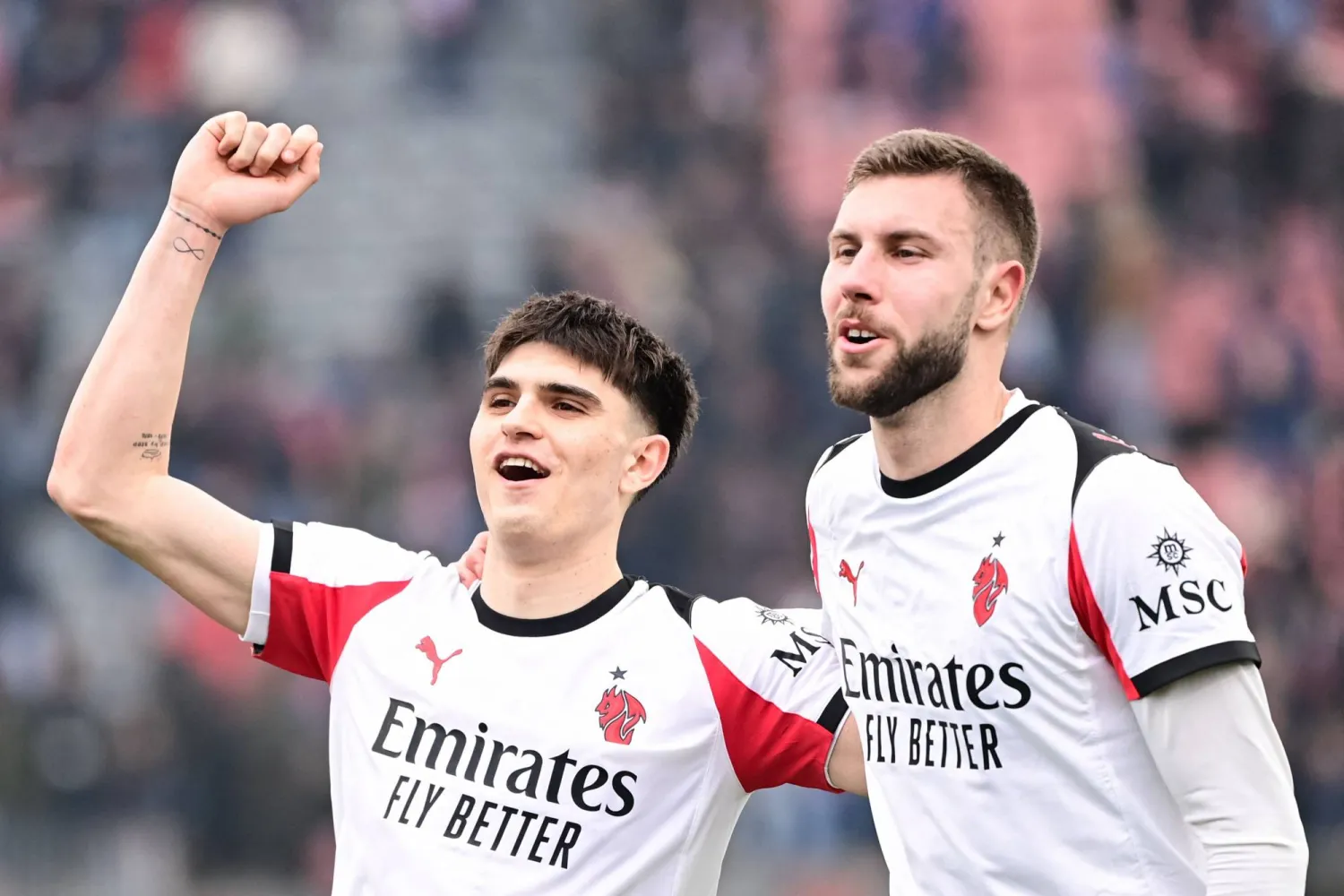  AC Milan's Italian defender #33 Davide Bartesaghi (L) and AC Milan's Serbian defender #31 Strahinja Pavlovic (R) celebrate at the end of the Italian Serie A football match between US Cremonese and AC Milan at the Giovanni Zini Stadium in Cremona, northern Italy on March 1, 2026. (AFP) 