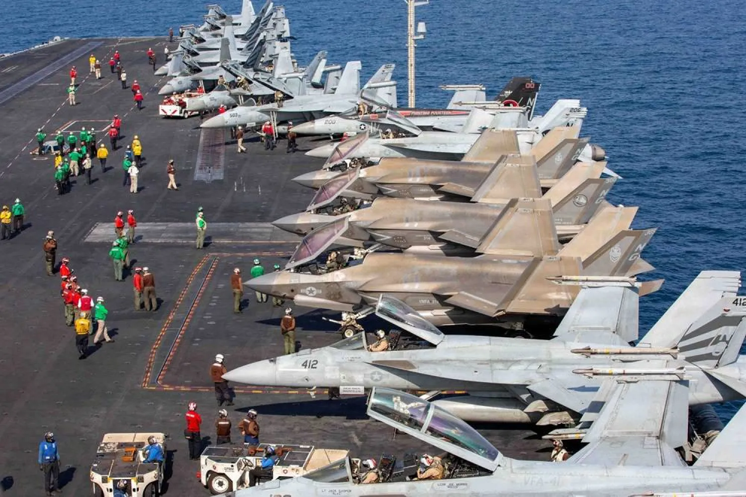 Aircraft attached to Carrier Air Wing (CVW) 9 sit on the flight deck of the US Navy Nimitz-class aircraft carrier USS Abraham Lincoln in support of the Operation Epic Fury attack on Iran, February 28, 2026. (US Navy/Handout via Reuters)
