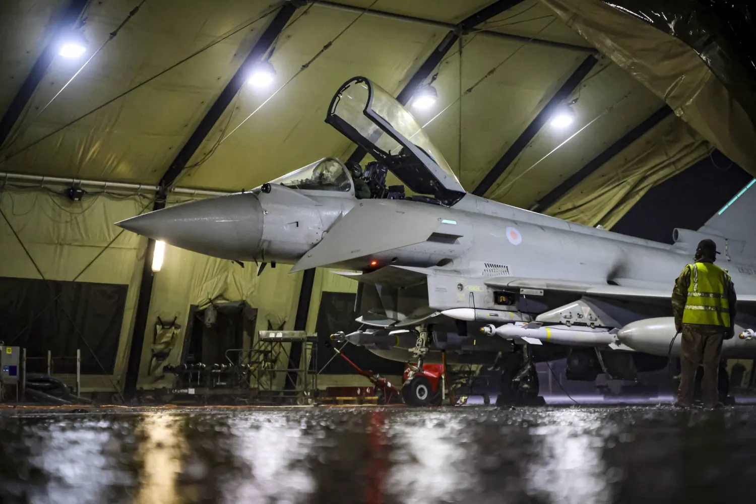 In this image provided by the UK Ministry of Defense, a Royal Air Force Typhoon FGR4 is prepared to take off to carry out airstrikes against Houthi targets in Yemen, from RAF Akrotiri, Cyprus, Monday, Jan. 22, 2024. (AS1 Leah Jones/Ministry of Defence via AP)