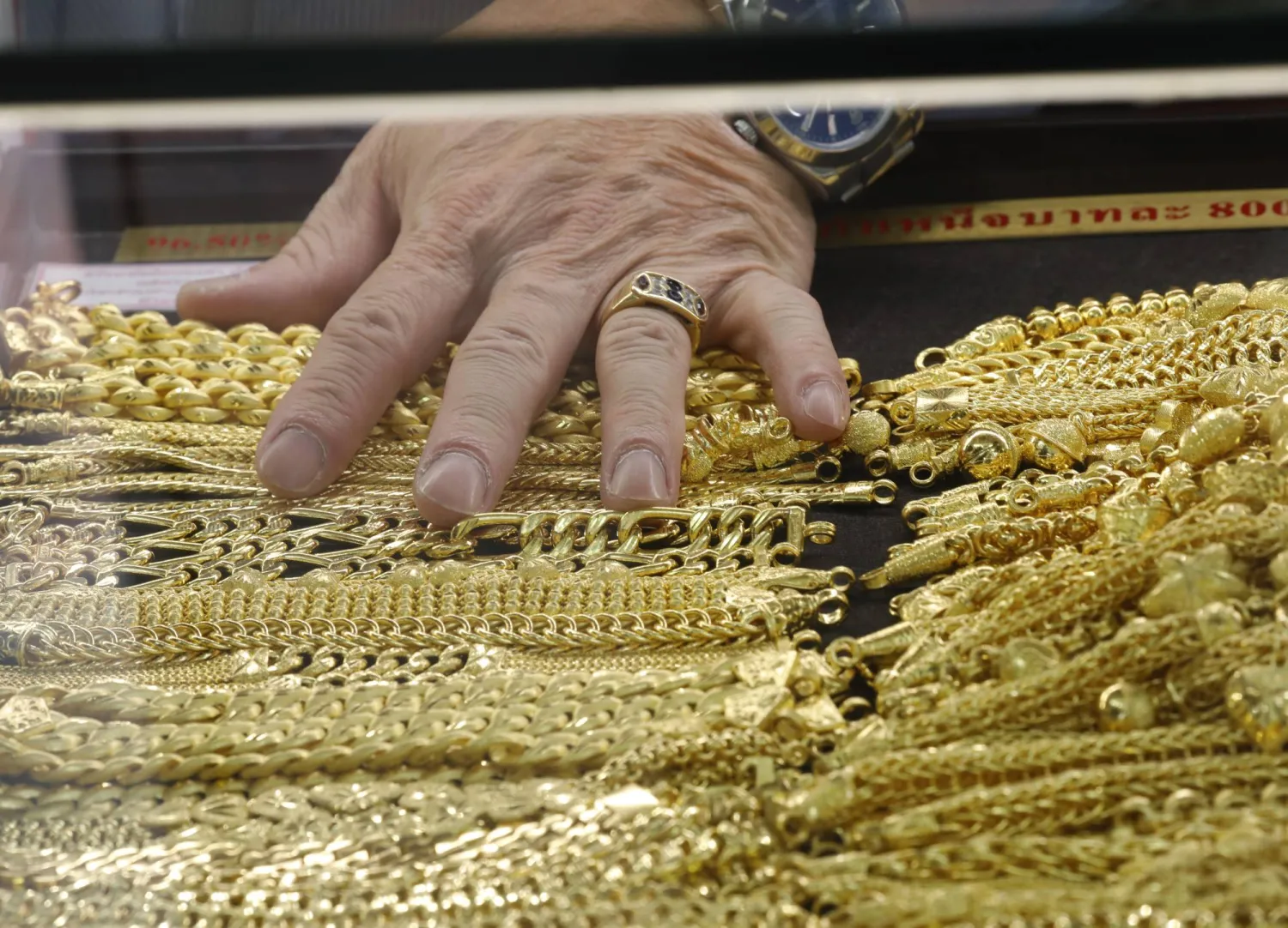 A goldsmith displays gold ornaments at the Hua Seng Heng gold shop in Bangkok, Thailand, 01 March 2026. EPA/NARONG SANGNAK