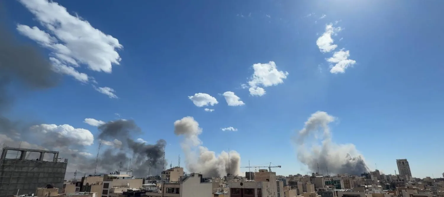 Plumes of smoke rise after a strike in Tehran, Iran, Sunday, March 1, 2026. (AP Photo)