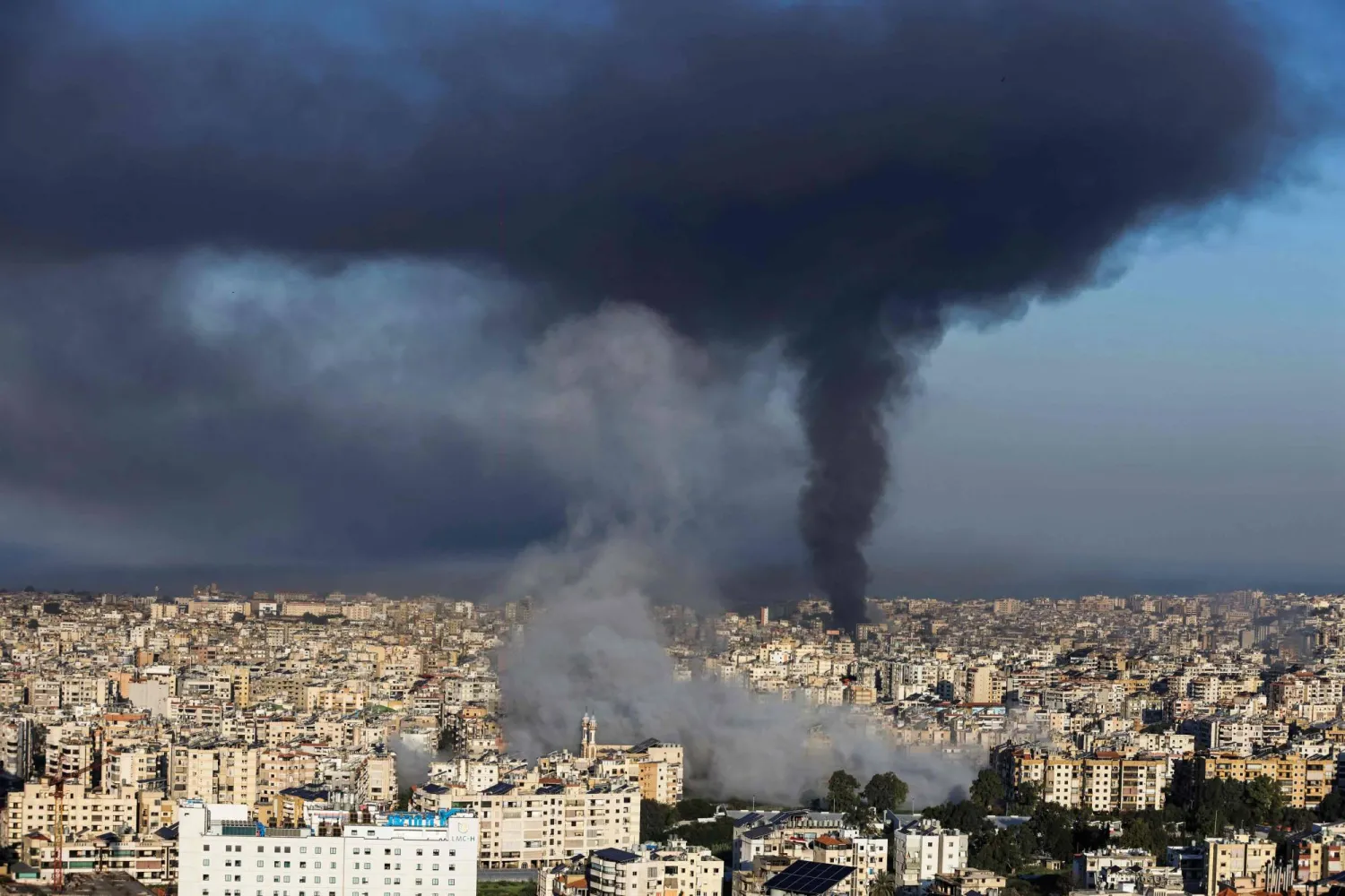 Plumes of smoke rise from the sites of Israeli airstrikes on the southern suburbs of Beirut on March 3, 2026. (Photo by IBRAHIM AMRO / AFP)