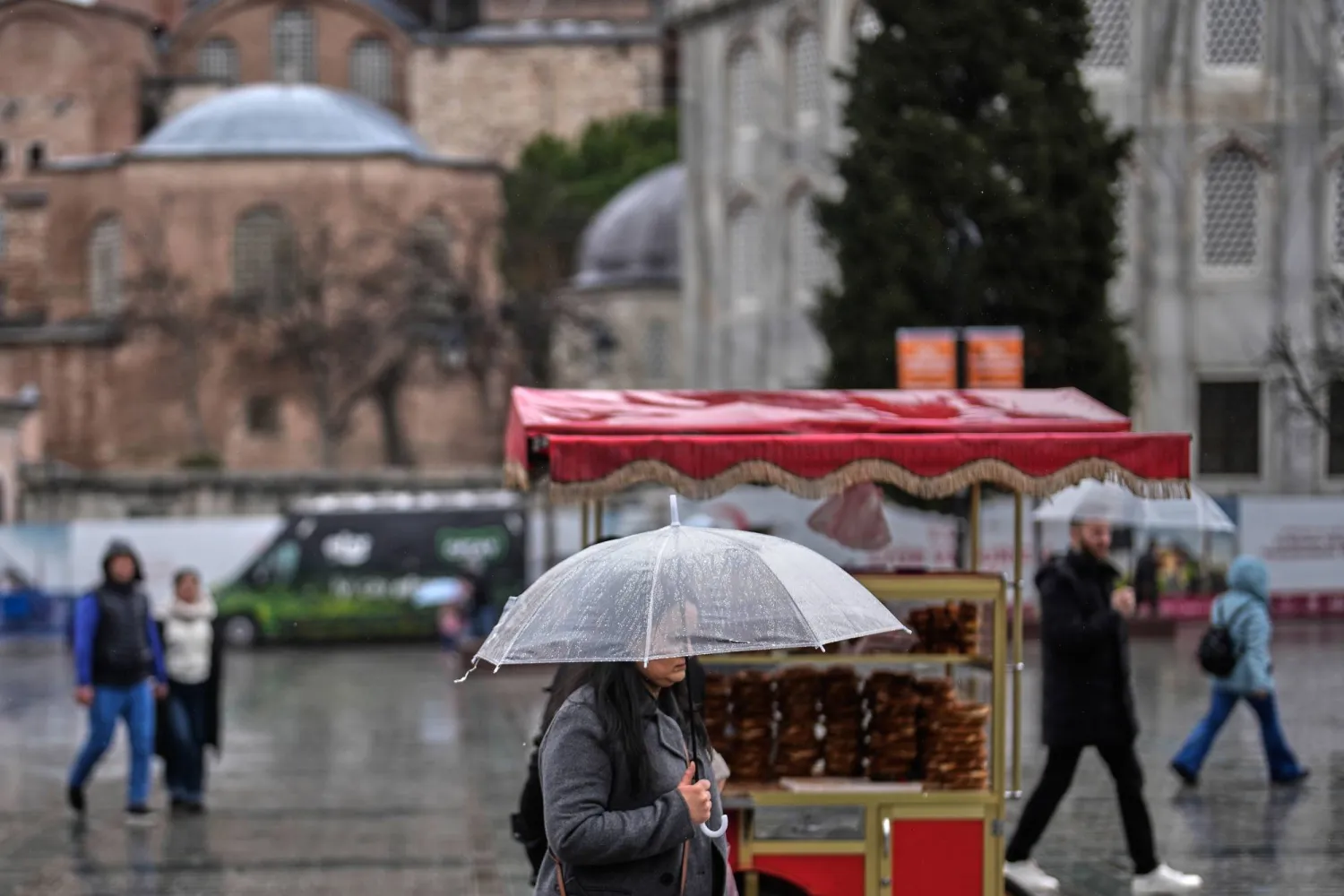 A woman holding an umbrella on a rainy day during the holy fasting month of Ramadan outside the Hagia Sophia mosque in Istanbul, Türkiye, Friday, Feb. 27, 2026. (AP) 