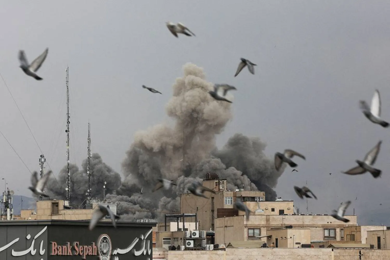 Birds fly as smoke rises following an explosion, after Israel and the US launched strikes on Iran, amid the US-Israel conflict with Iran, in Tehran, Iran, March 2, 2026. Majid Asgaripour/WANA (West Asia News Agency) via Reuters