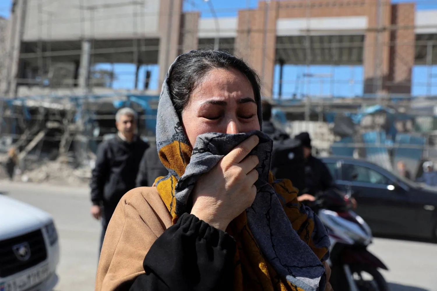 A woman reacts on the street following an Israeli and US strike on a police station, amid the US-Israeli conflict with Iran, in Tehran, Iran, March 3, 2026. Majid Asgaripour/WANA (West Asia News Agency) via Reuters