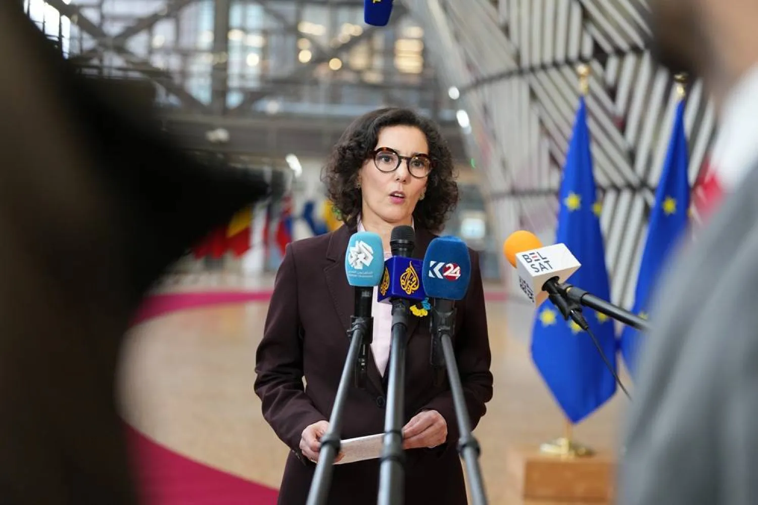  European Commissioner for Preparedness and Crisis Hadja Lahbib speaks with the media as she arrives for a meeting of EU foreign ministers at the European Council building in Brussels, Monday, Feb. 23, 2026. (AP) 