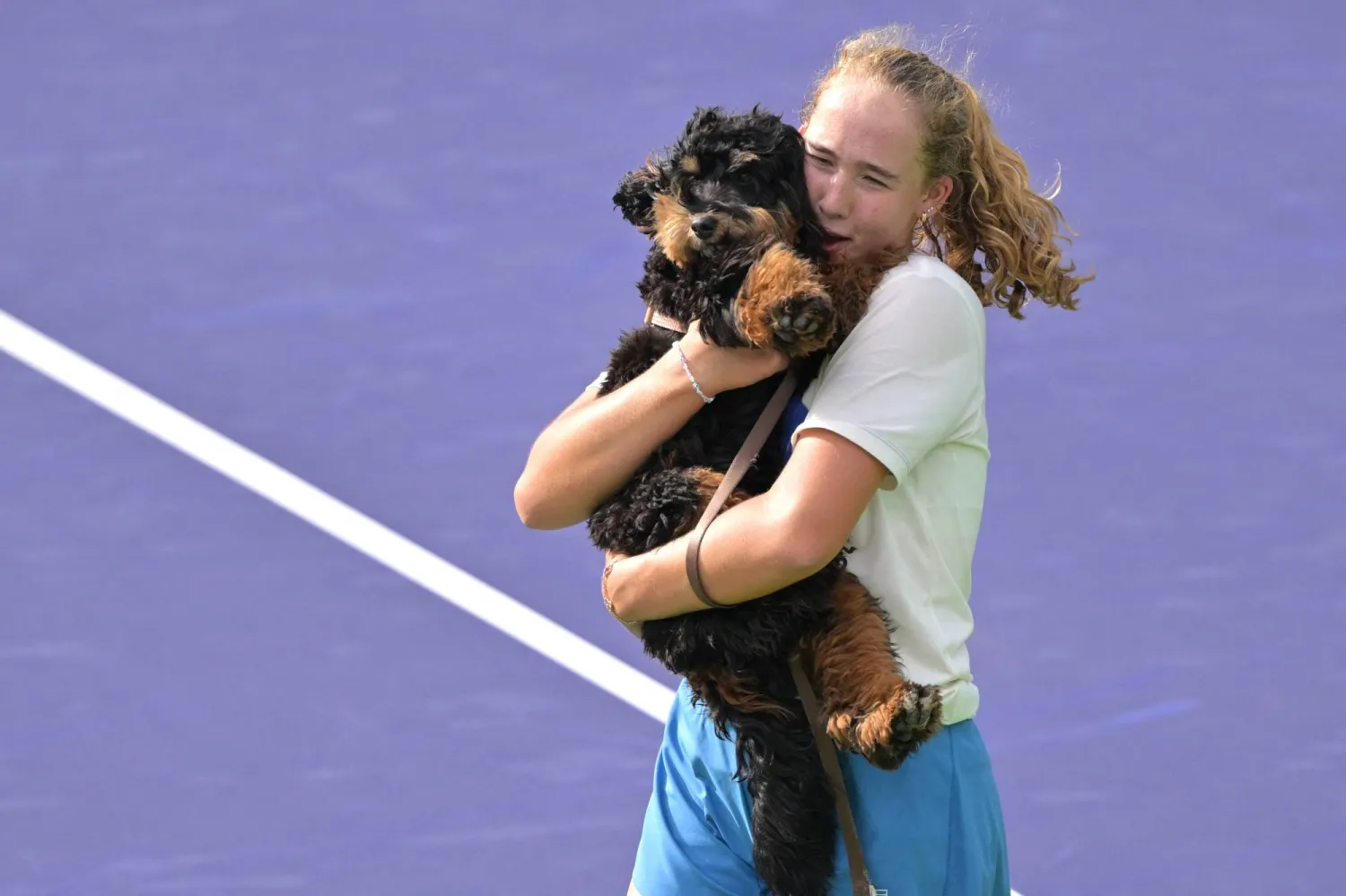Mar 2, 2026; Indian Wells, CA, USA;  Mirra Andreeva (RUS) holds her dog Ressi during her practice session for the BNP Paribas Open at the Indian Wells Tennis Garden. Mandatory Credit: Jayne Kamin-Oncea-Imagn Images