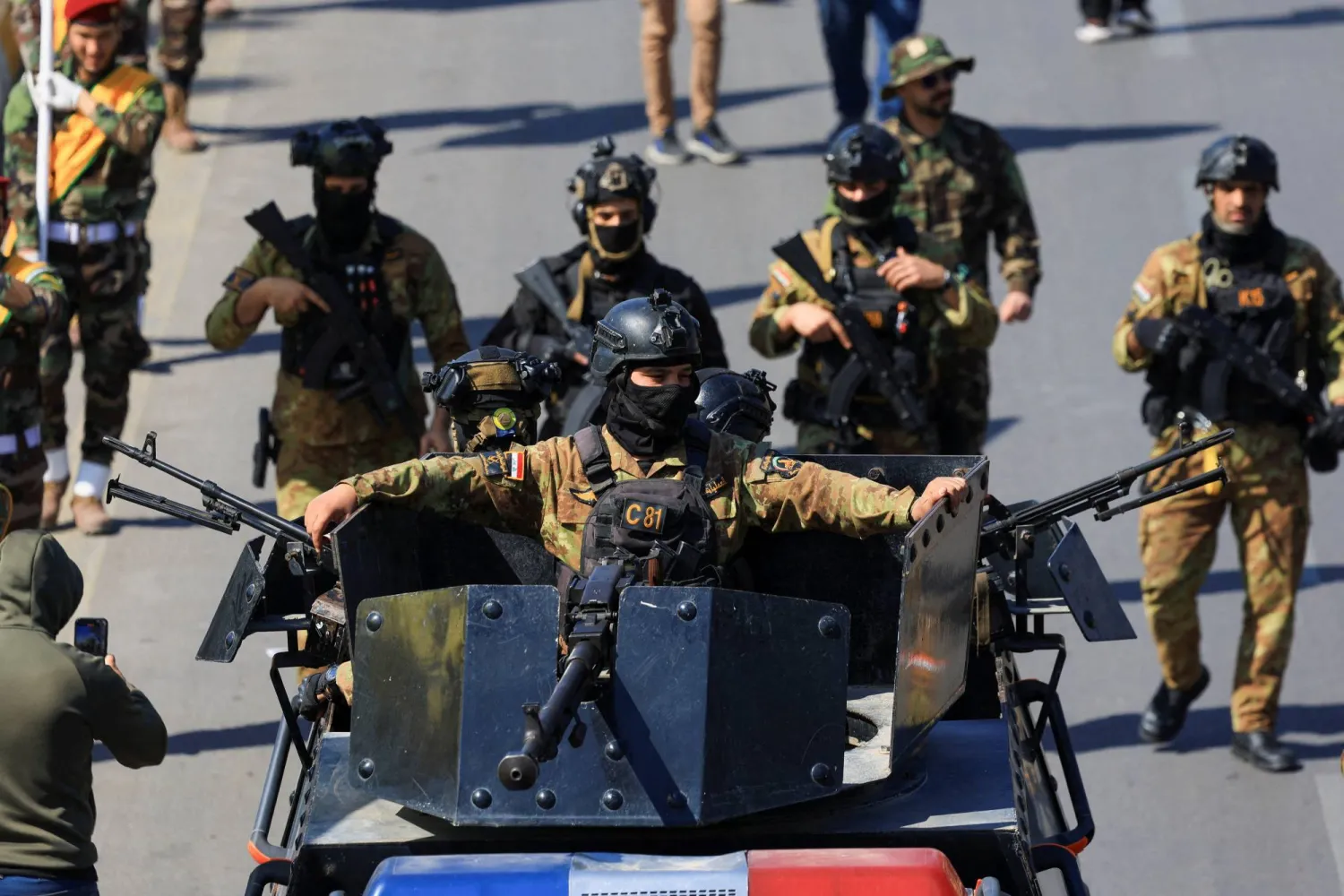 Members of the Iraqi armed group Kataeb Hezbollah attend the funeral of their members, who were killed in an airstrike that targeted a Hashd al‑Shaabi headquarters near the western al‑Qaim district on the Syrian border, amid the US-Israel conflict with Iran, in Baghdad, Iraq, March 2, 2026. REUTERS/Thaier Al-Suda     