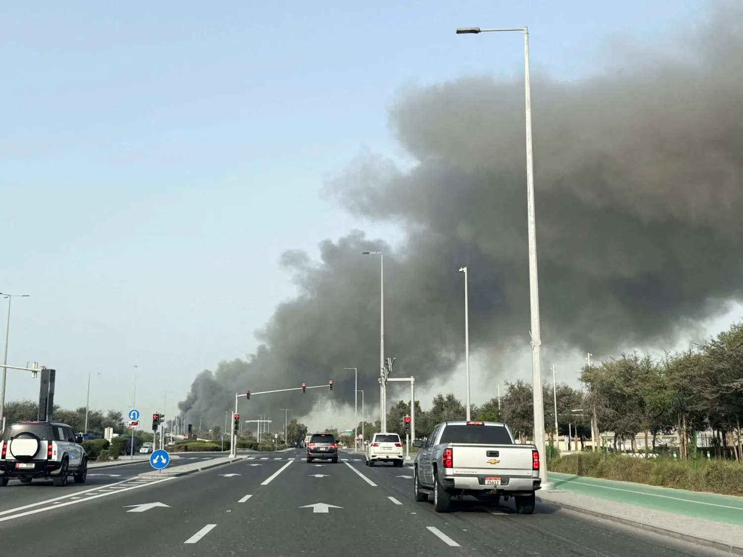 FILE PHOTO: Smoke billows from Zayed port after an Iranian attack in Abu Dhabi, United Arab Emirates, March 1, 2026. REUTERS/Abdelhadi Ramahi/File Photo