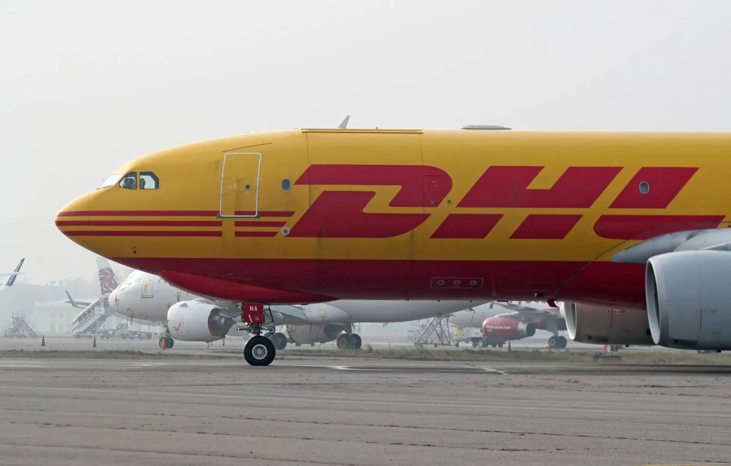 FILE PHOTO: A view shows a DHL plane at the airport of Almaty, Kazakhstan December 5, 2024. REUTERS/Pavel Mikheyev/File Photo
