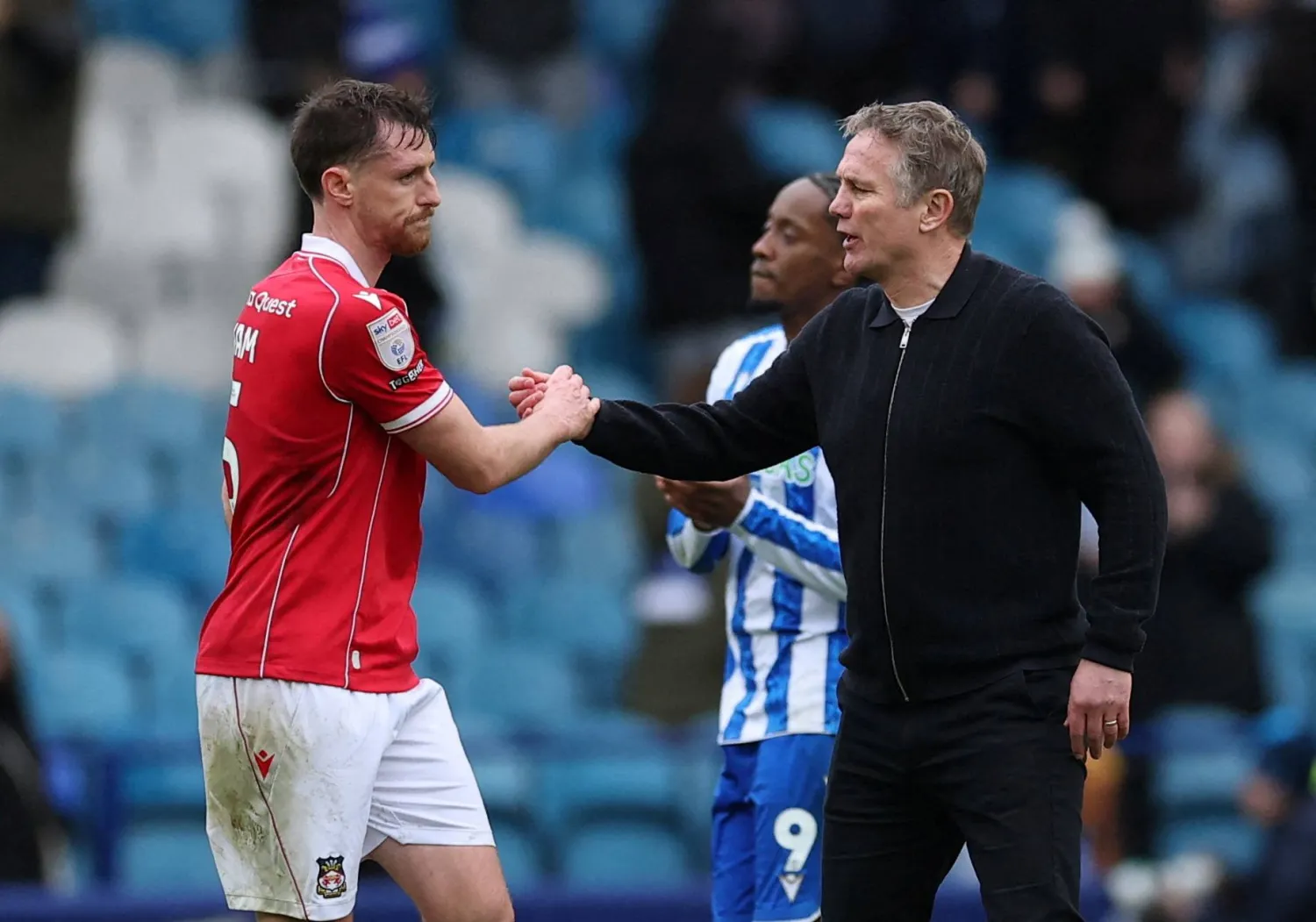 FILE PHOTO: Soccer Football - Championship - Sheffield Wednesday v Wrexham - Hillsborough Stadium, Sheffield, Britain - January 31, 2026 Wrexham's Dominic Hyam and manager Phil Parkinson celebrate after the match Action Images/Andrew Boyers