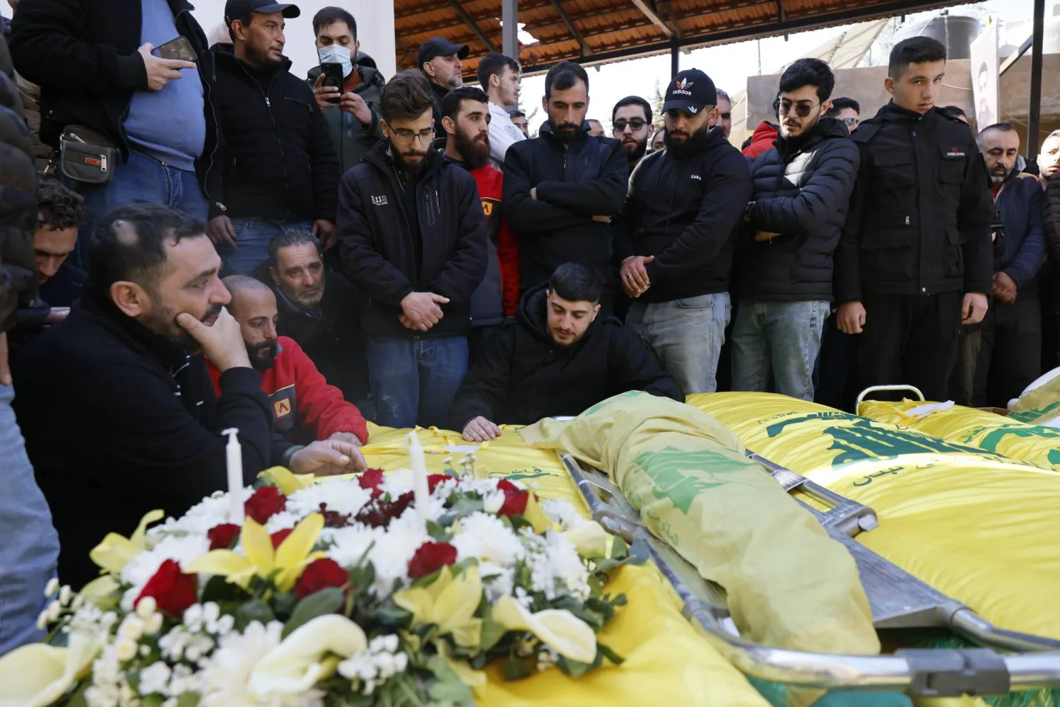 Mourners gather around the Hezbollah-draped coffins of people killed in Israeli airstrikes on Baalbek, during their funeral in the city of Baalbek, in Bekaa valley, Lebanon, 05 March 2026. EPA/WAEL HAMZEH