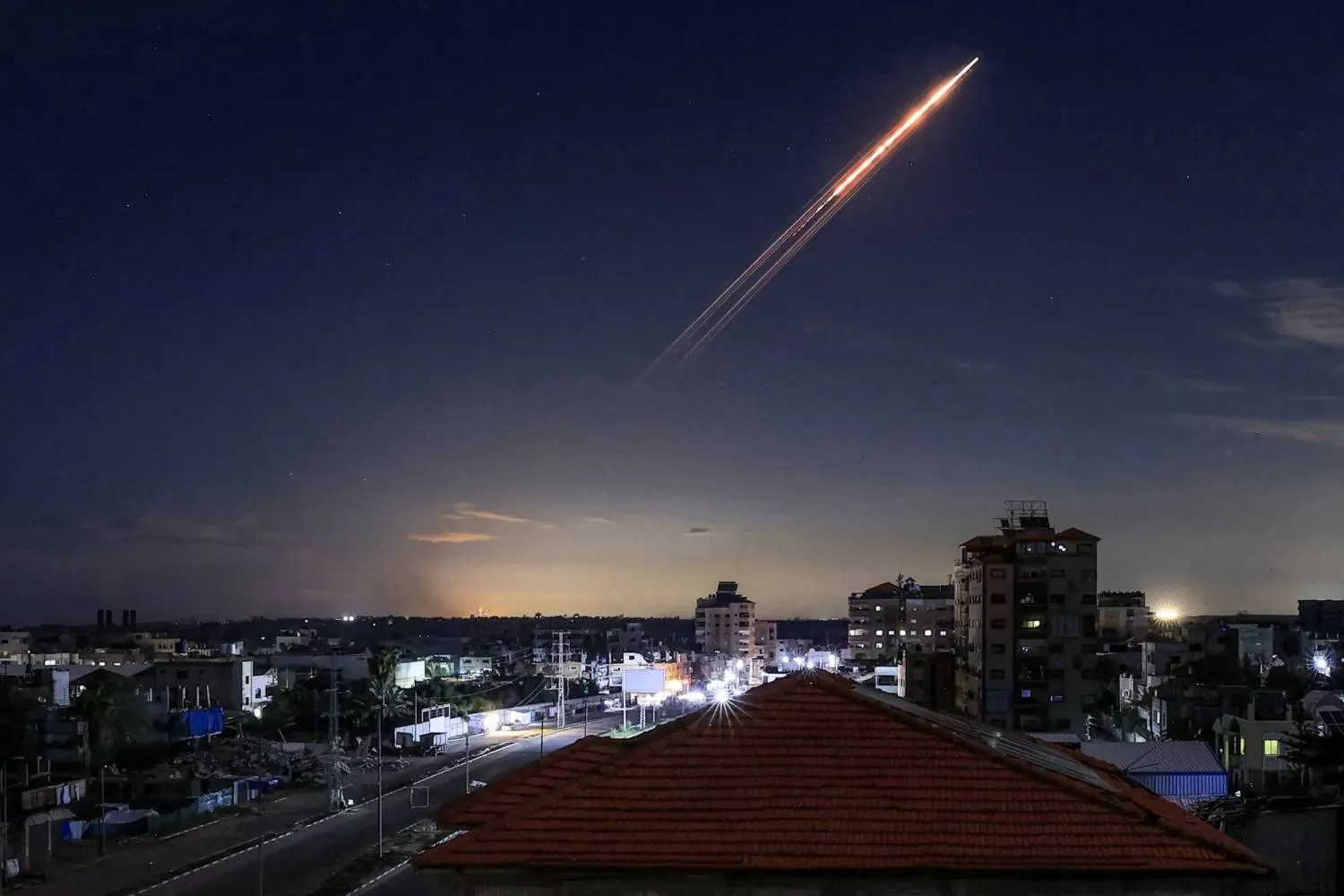 A missile launched from Iran is seen in the sky over the Bureij Palestinian refugee camp in central Gaza (AFP) 