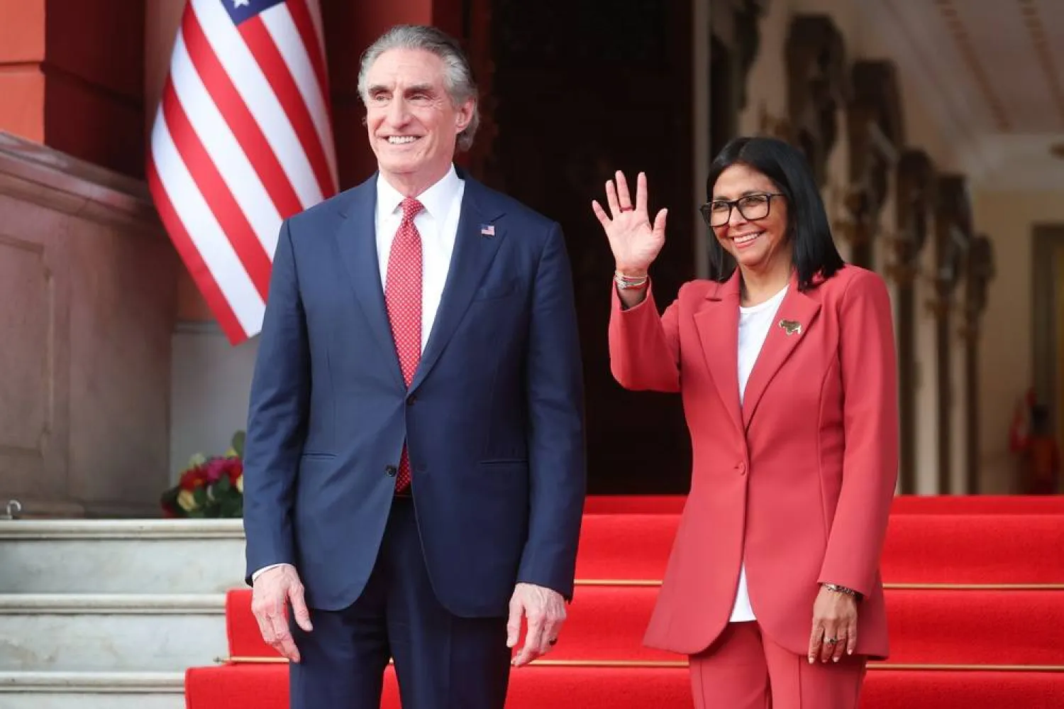 Delcy Rodriguez (R), the acting president of Venezuela, waves alongside US Secretary of the Interior Doug Burgum at the end of a meeting in Caracas, Venezuela, 04 March 2026. (EPA)
