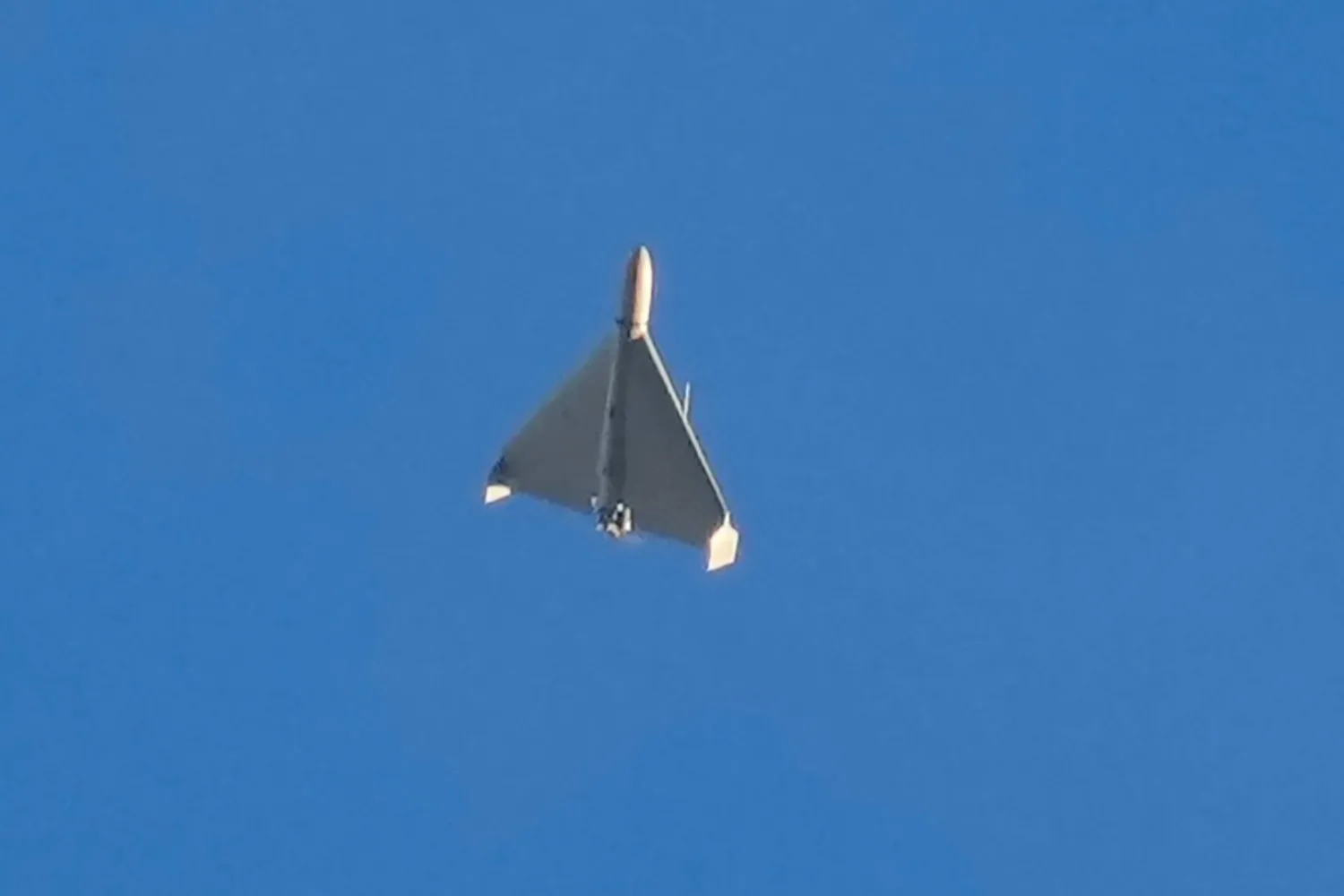 An Iranian Shahed exploding drone launched by Russia flies through the sky seconds before it struck buildings in Kyiv, Ukraine, on Oct. 17, 2022. (AP)