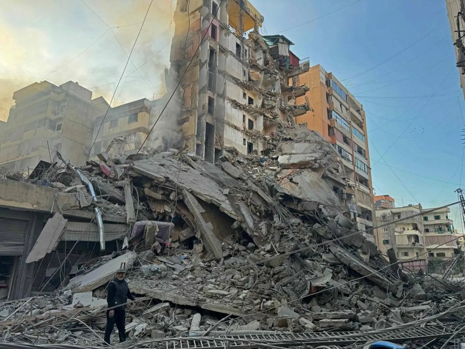 A man inspects the debris of destroyed buildings at the site of an Israeli airstrike that targeted Haret Hreik neighborhood in Beirut's southern suburbs, on March 7, 2026. (AFP)