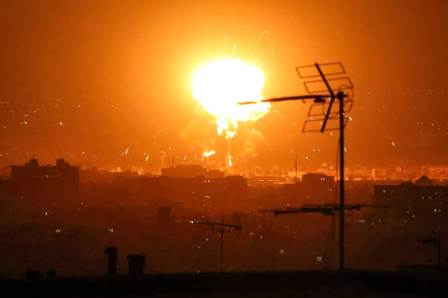 Explosions erupt following strikes in Tehran on March 7, 2026. (Photo by ATTA KENARE / AFP)