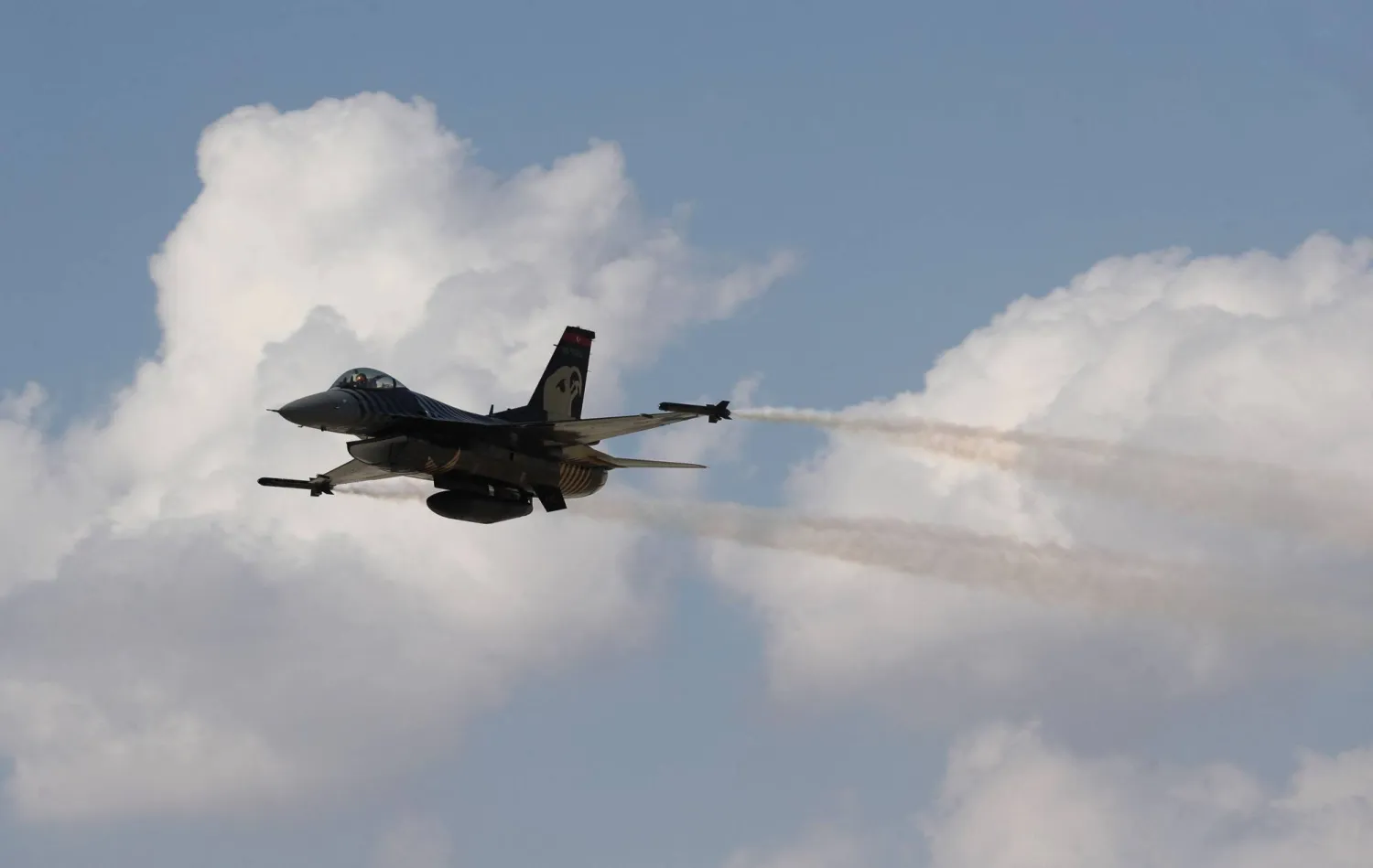 An acrobatic plane pilot performs with General Dynamics F-16 Solo Turk aerial aerobatic aircraft during the 5th Sivrihisar Airshow in Sivrihisar district of Eskisehir, in Türkiye, on September 13, 2020. (AFP)