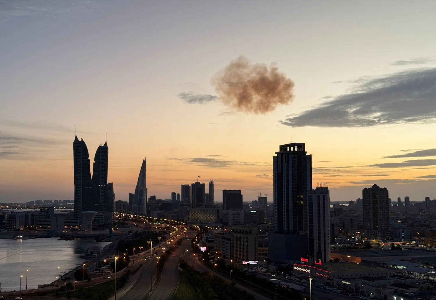 Smoke rises after an Iranian drone was intercepted over the Bahrain Financial Harbour towers, which houses the Israeli embassy, amid the US-Israeli conflict with Iran, in Manama, Bahrain, March 6, 2026. Picture taken on a mobile phone. REUTERS/Stringer