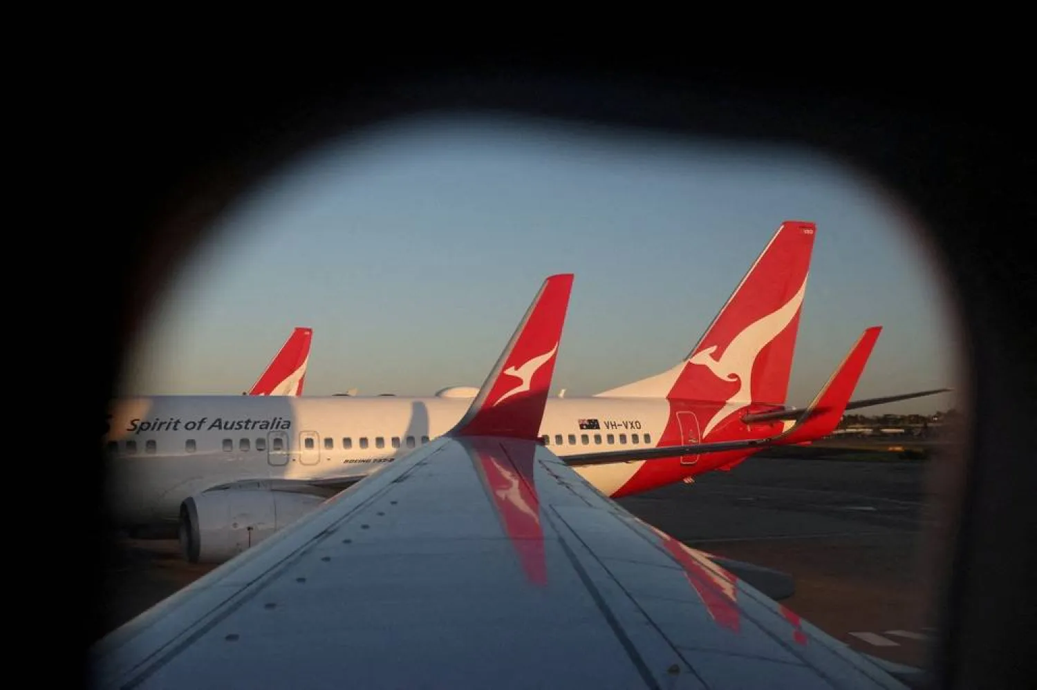 A Qantas logo is visible on the tail of an airplane at an airport in Sydney, Australia, September 18, 2025. (Reuters)