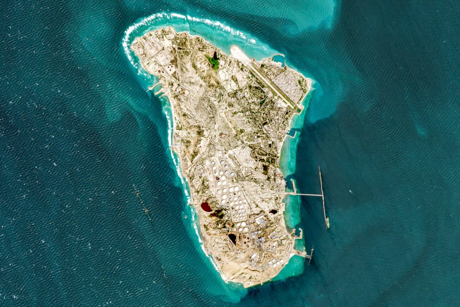 This handout image taken by the European Space Agency (ESA) captured by the Copernicus Sentinel-2 satellite shows a view of Iran's Kharg Island, which hosts the country's main crude export terminal and is responsible for the overwhelming majority of its oil shipments to the world, about 25 kilometers south of the mainland in the north of the Gulf, on March 2, 2026. (AFP / ESA)