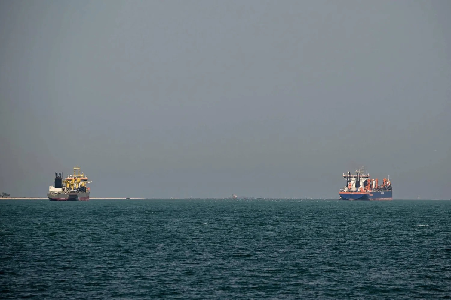 Commercial vessels are pictured offshore in Dubai on March 11, 2026. (AFP)