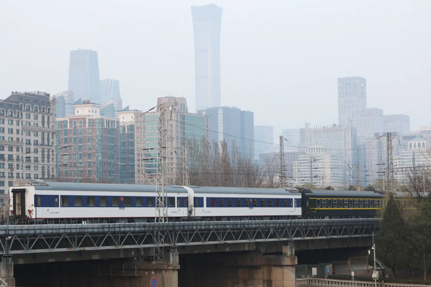 A passenger train with cross-border service to North Korea's Pyongyang leaves Beijing Railway Station in Beijing, China March 12, 2026. REUTERS/Florence Lo