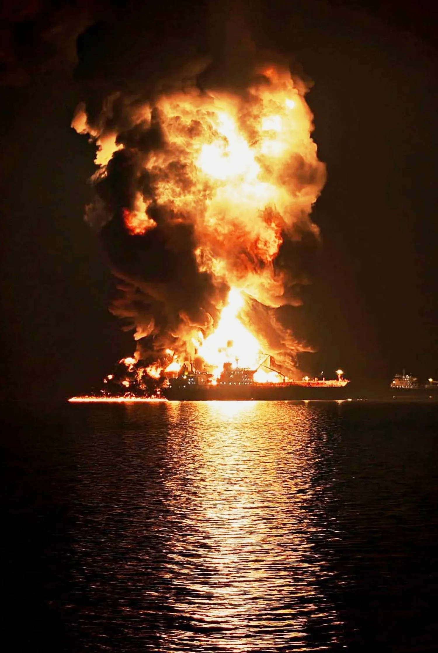 An oil tanker burns after being hit by an Iranian strike in the ship-to-ship transfer zone at Khor al-Zubair port near Basra, Iraq, late Wednesday, March 11, 2026. (AP Photo)