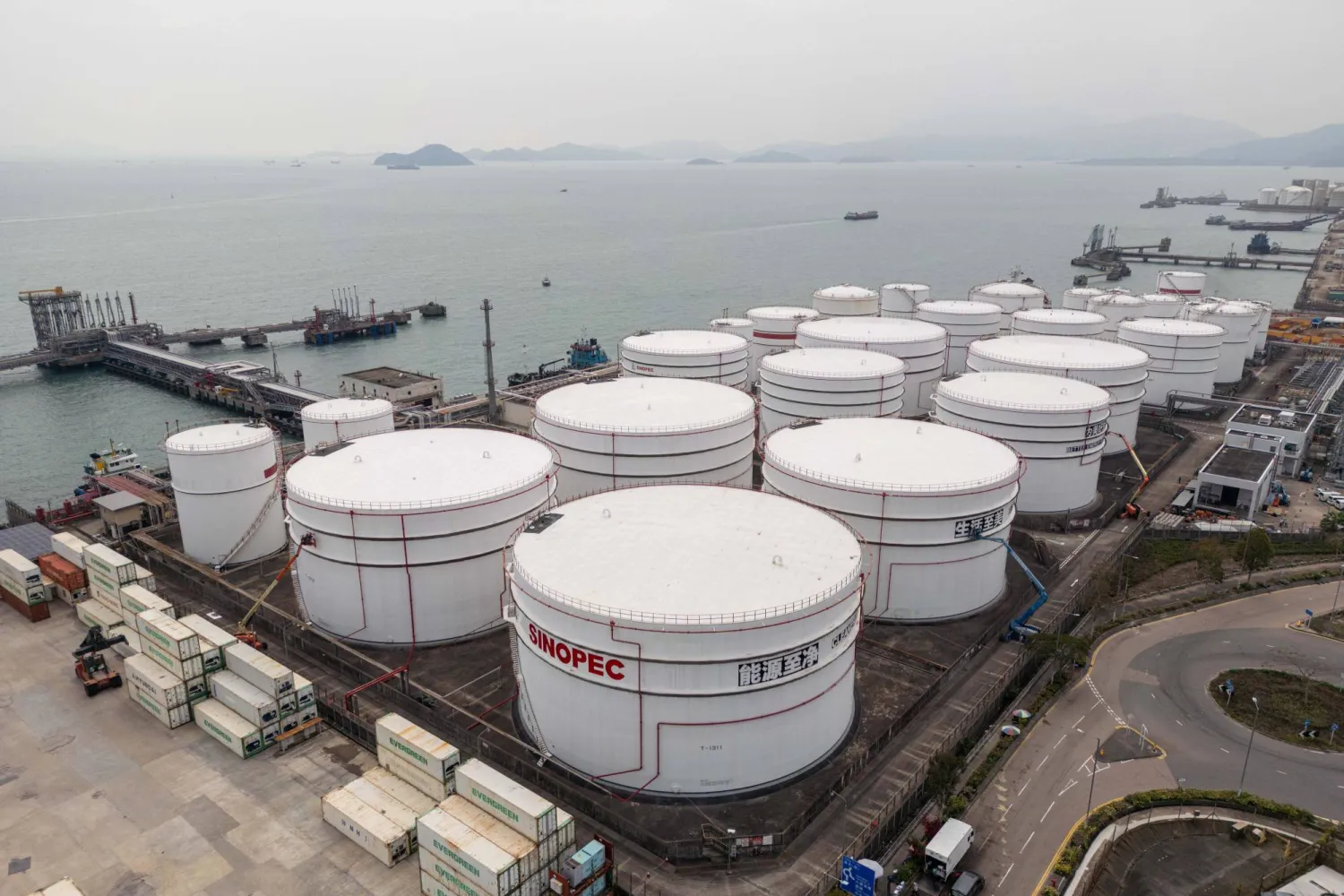 09 March 2026, China, Hong Kong: Oil Storage Tanks at the SINOPEC Oil Terminal at Tsing Yi in Hong Kong. Photo: Vernon Yuen/Nexpher via ZUMA Press Wire/dpa
