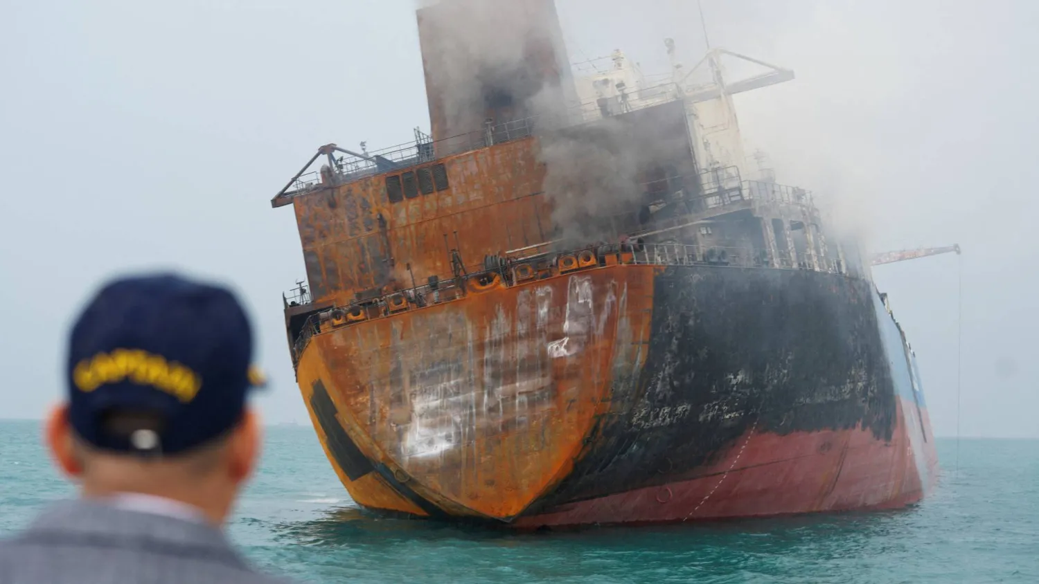 A foreign tanker carrying Iraqi fuel oil damaged after catching fire in Iraq's territorial waters, following unidentified attacks that targeted two foreign tankers, according to Iraqi port officials, near Basra, Iraq, March 12, 2026.  REUTERS/Mohammed Aty