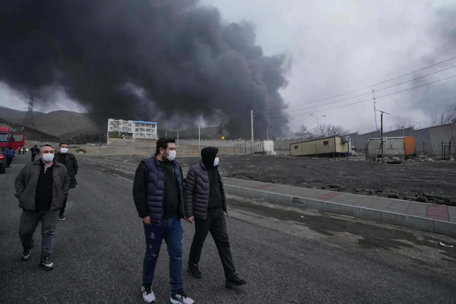 FILE - A thick plume of smoke rises Sunday, March 8, 2026, from an oil storage facility struck overnight in Tehran, Iran. (AP Photo/Vahid Salemi, File)
