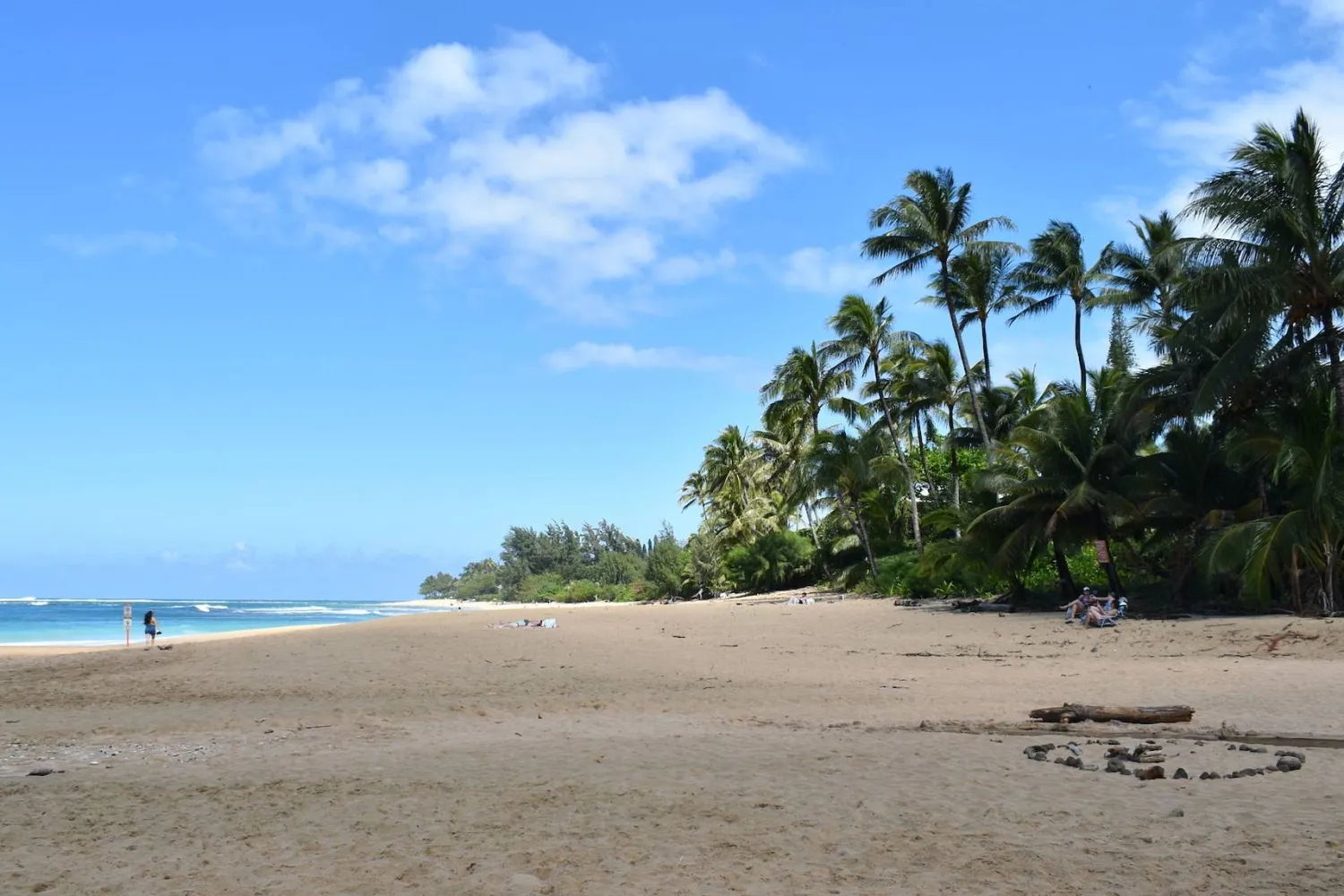 People spend time at Ha‘ena Beach Park, Monday, March 2, 2026, in Haena, Hawaii. (Noelle Fujii-Oride/Hawaii Civil Beat via AP)