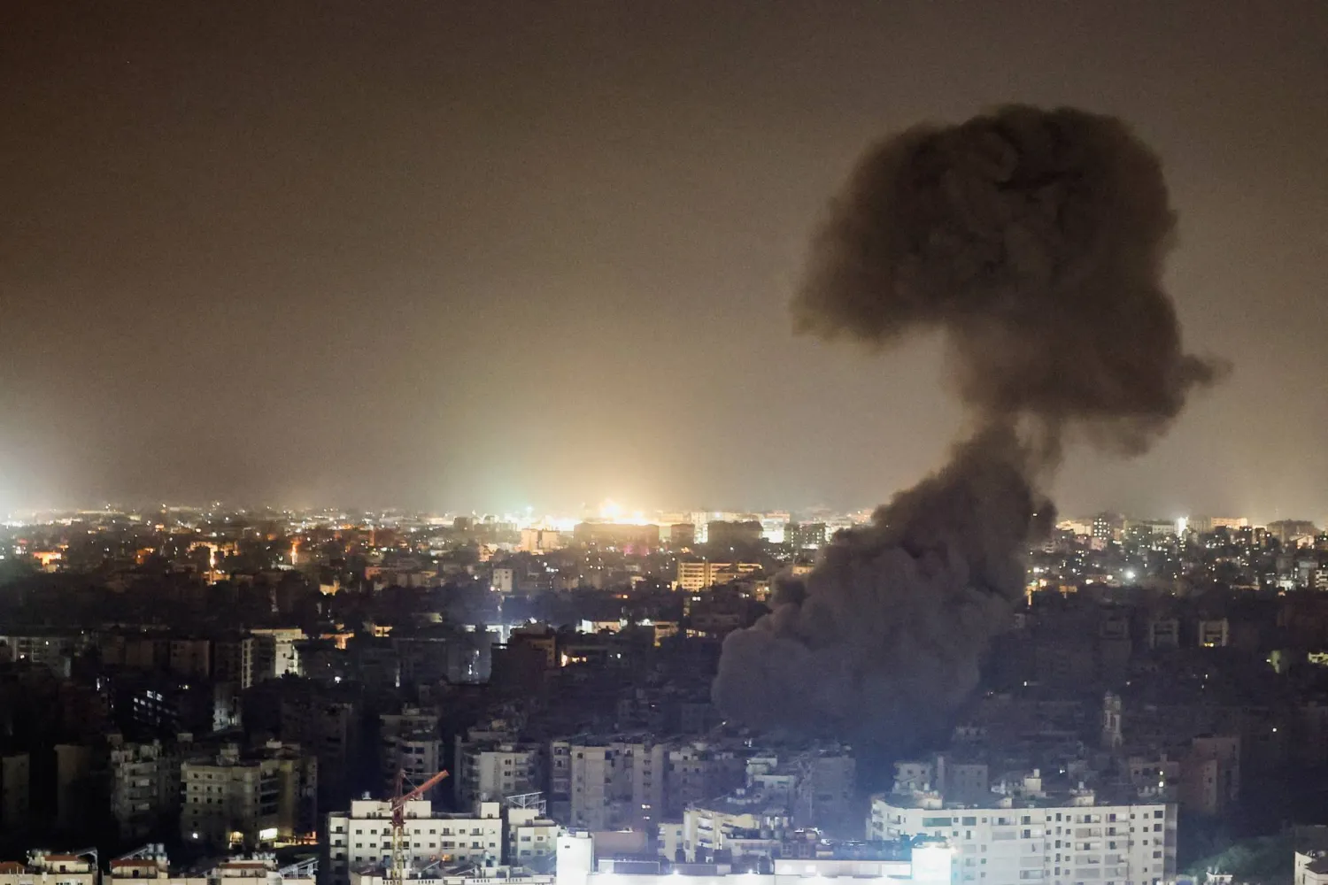 A plume of smoke billows following reported Israeli strikes in the southern suburbs of Beirut, after an escalation between Hezbollah and Israel, amid the US-Israeli conflict with Iran, Lebanon, March 13, 2026. (Reuters)