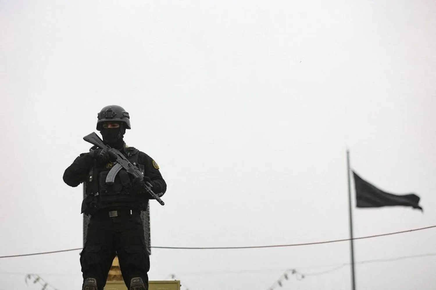 A security personnel stands guard as Iranians take part in a protest marking the annual al-Quds Day (Jerusalem Day) on the last Friday of the holy month of Ramadan, amid the US-Israeli conflict with Iran, in Tehran, Iran, March 13, 2026. Majid Asgaripour/WANA (West Asia News Agency) via Reuters