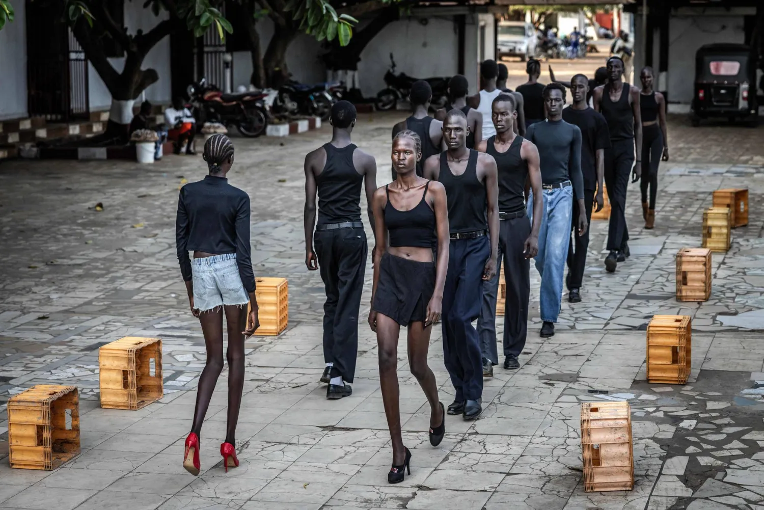 Professional models from the Juba-based modelling agency Jubalicious practice their catwalking during a modelling training session at a hotel in Juba on February 19, 2026.  (Photo by Luis TATO / AFP)