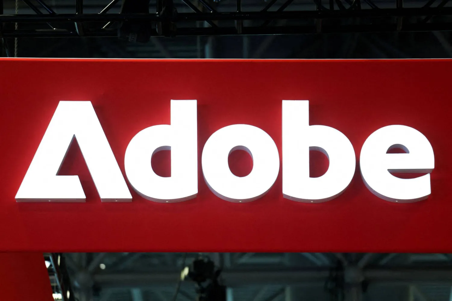 FILE PHOTO: Signage for Adobe is displayed at National Retail Federation (NRF) 2026: Retail's Big Show, in New York City, US, January 12, 2026. REUTERS/Kylie Cooper/File Photo