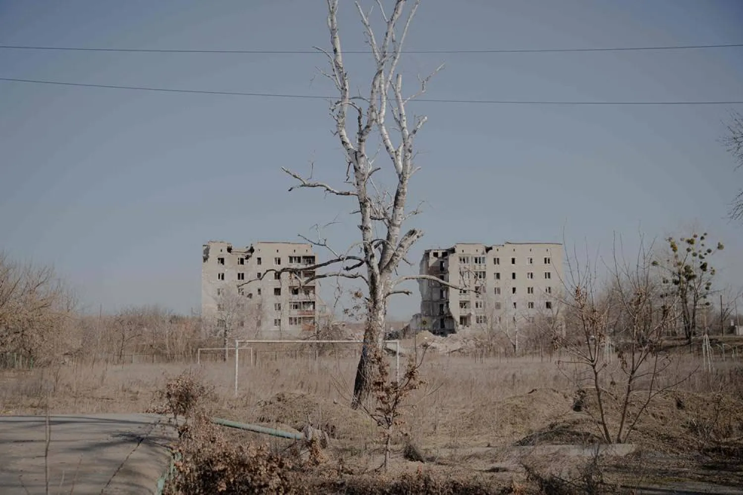 This photograph shows residential buildings heavily damaged by a Russian air strike at the beginning of the full-scale invasion, where more than 50 people were killed, in the center of the city of Izium, Kharkiv region on March 10, 2026, amid the Russian invasion of Ukraine. (AFP) 