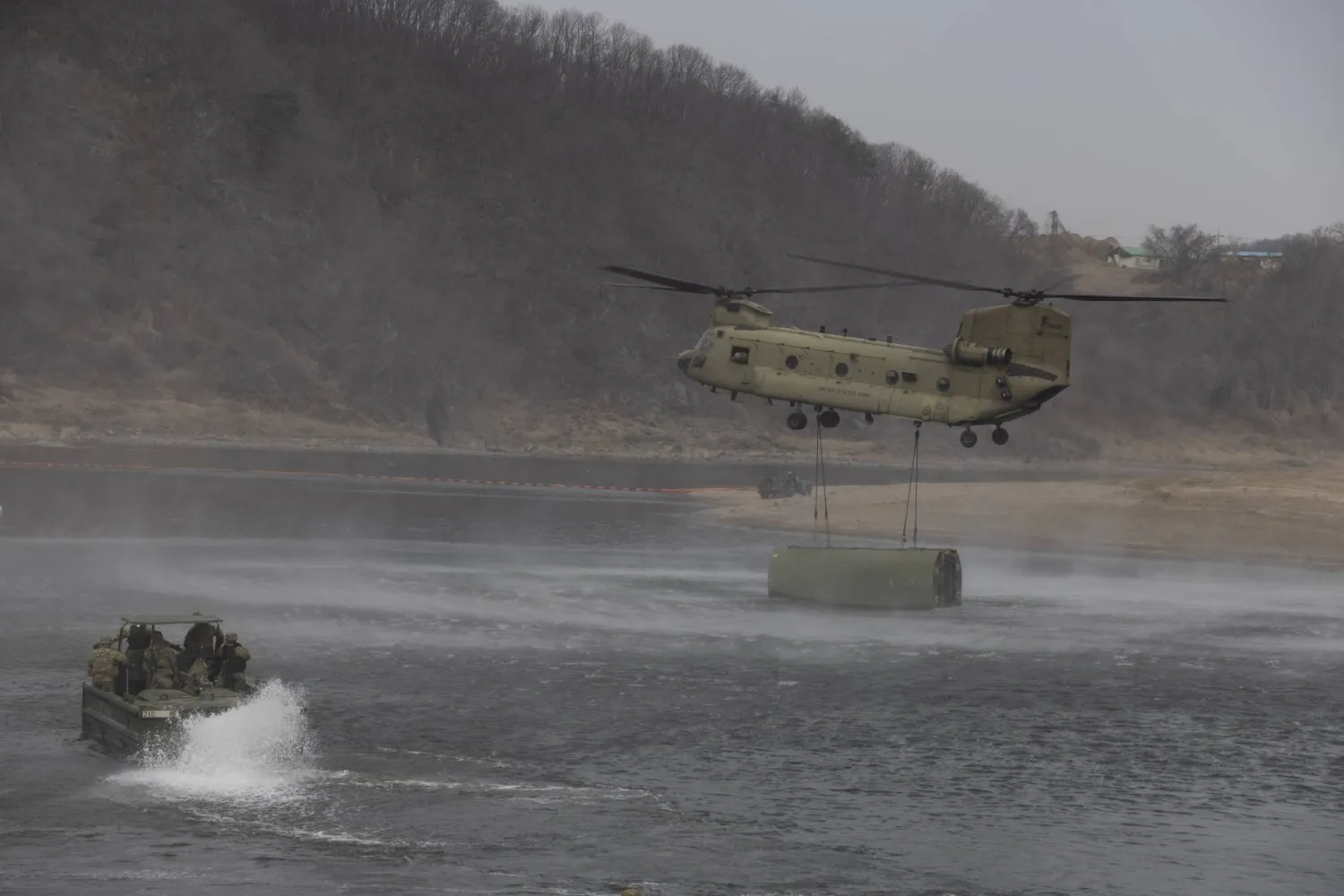US soldiers from the 2nd Infantry Division/ROK-US Combined Division, conducts a combined exercise (maneuvering, wet gap crossing) with South Korean soldiers from the Lightning Brigade, Capital Mechanized Infantry Division and 7th Engineer Brigade, as part of the Freedom Shield 26 exercise, in Yeoncheon, Gyeonggi province, South Korea, 14 March 2026. EPA/JEON HEON-KYUN