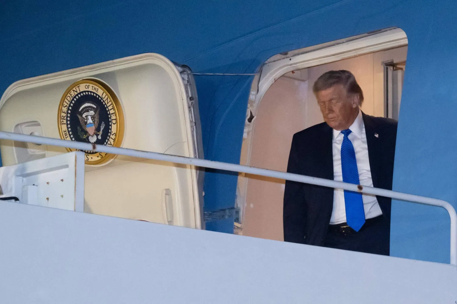 US President Donald Trump steps off Air Force One as he arrives at Palm Beach International Airport in West Palm Beach, Florida on March 13, 2026. (Photo by SAUL LOEB / AFP)