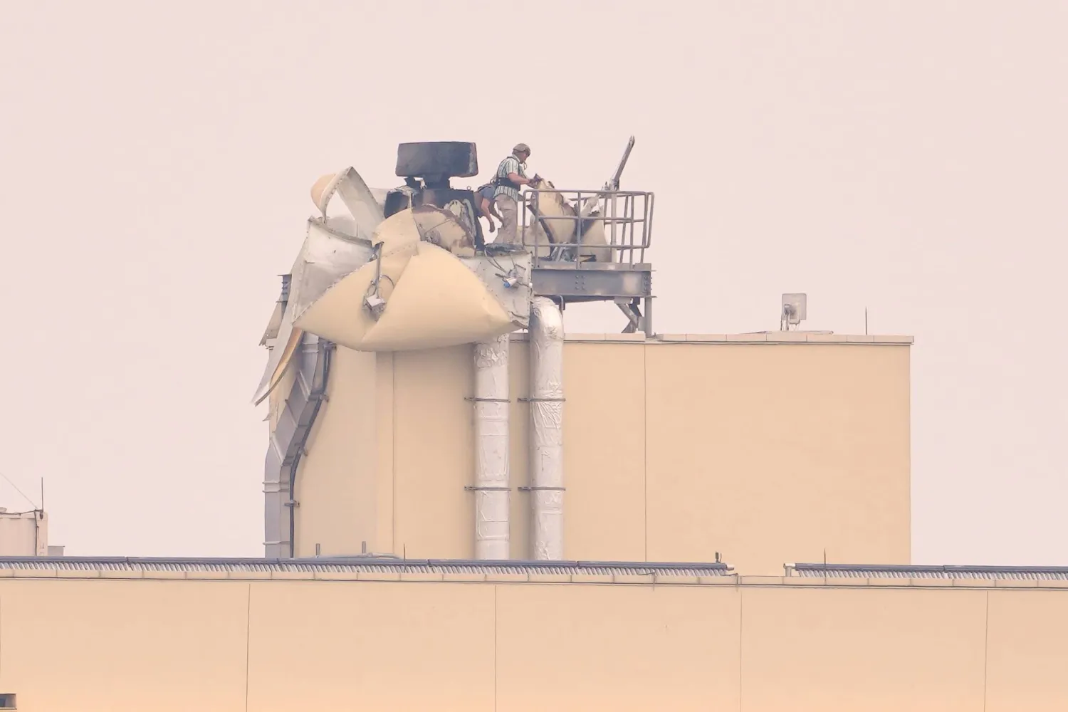 US soldiers inspect the damage caused by a bombing in Baghdad, Saturday, March 14, 2026. (AP Photo/Hadi Mizban)
