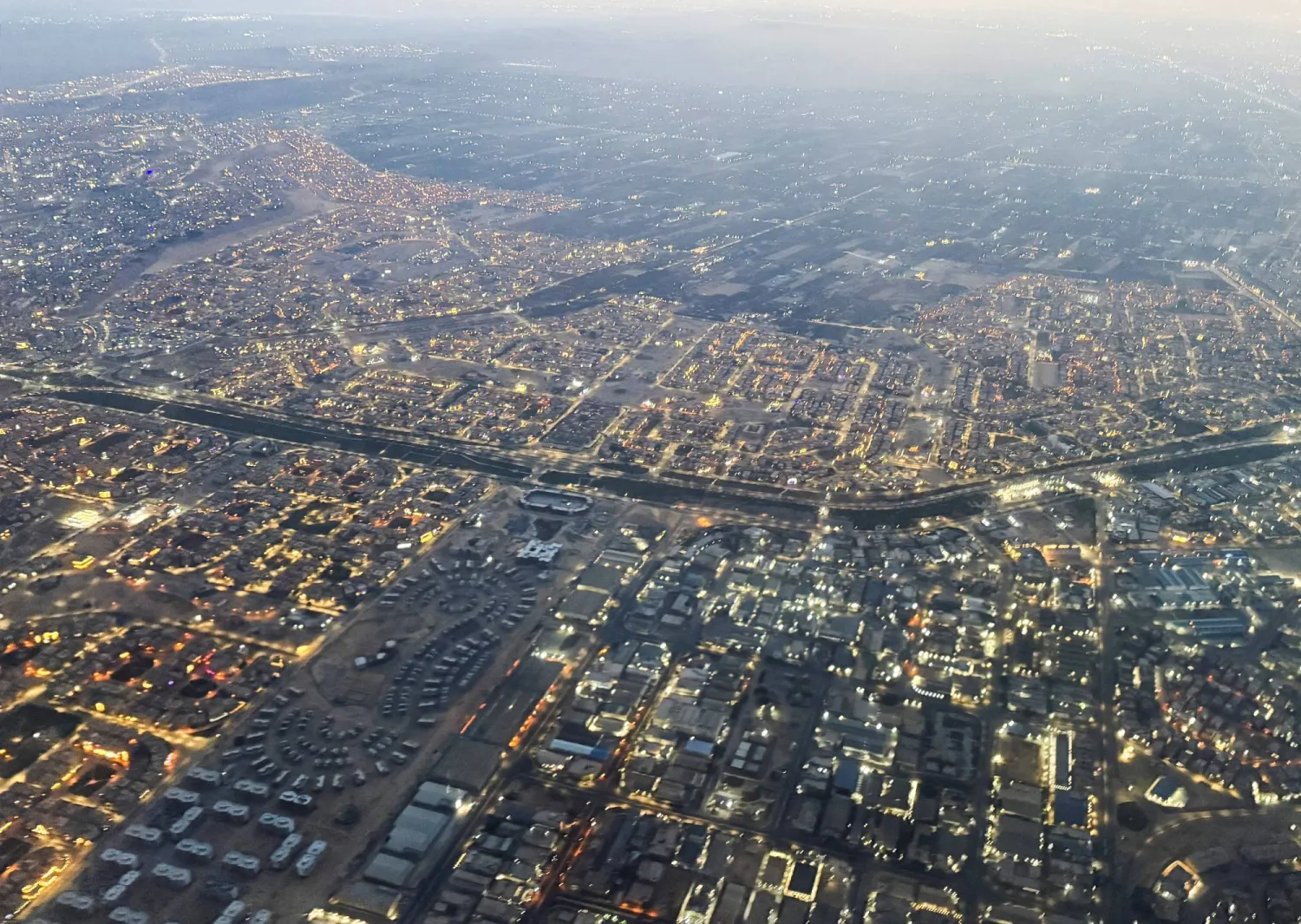 An aerial view shows Cairo's traffic with buildings and houses, through the window of a Turkish Airlines plane, in Cairo, Egypt March 12, 2026. REUTERS/Amr Abdallah Dalsh