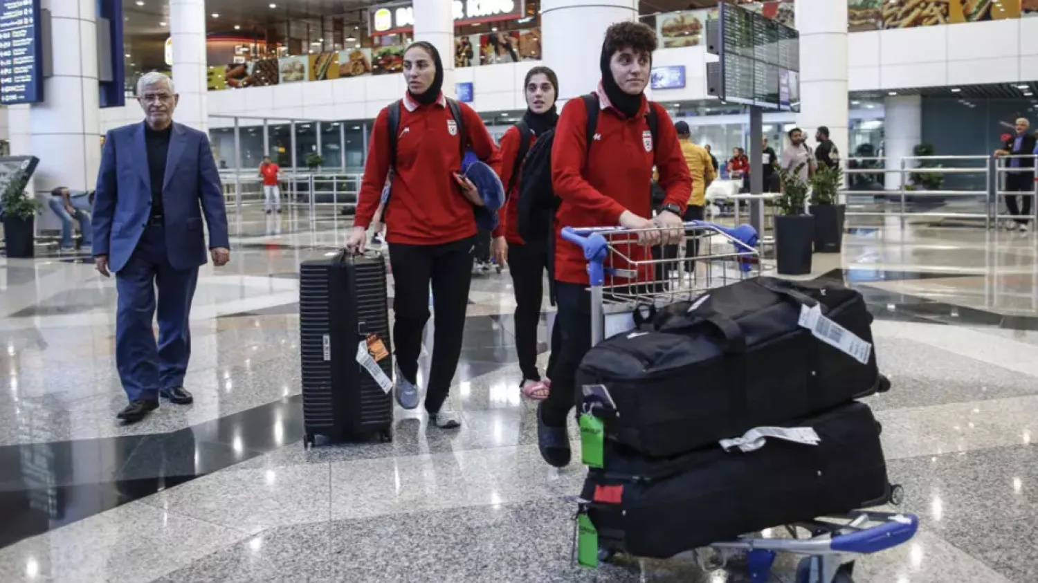 The members of Iran's women's football team who did not claim asylum in Australia arrived at the Kuala Lumpur International Airport on March 11, 2026 © ARIF KARTONO / AFP
